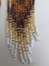 Load image into Gallery viewer, gold, brown, and white Indigenous beaded earrings on a light gray background