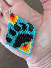 Load image into Gallery viewer, bear paw earrings in palm of hand