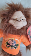 Load image into Gallery viewer, Skookum Sasquatch stuffie with Every Child Matters, Bill Helin design
