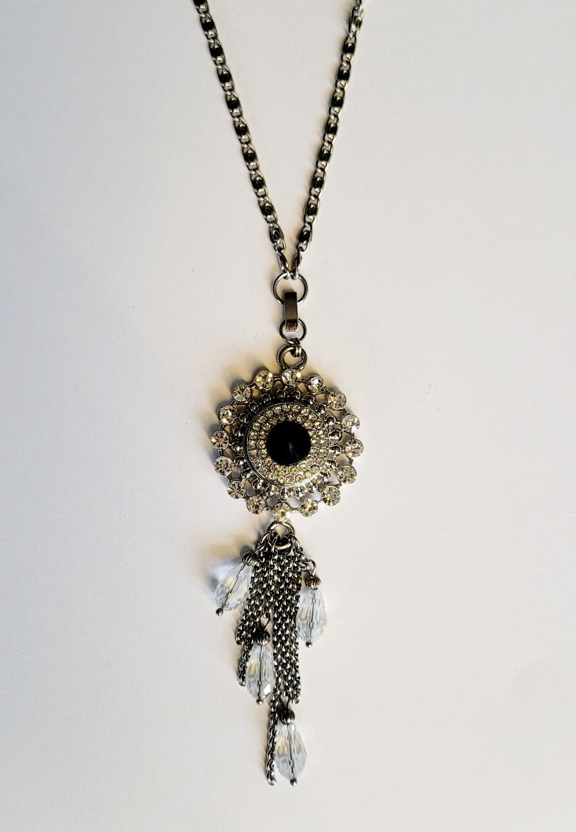 Necklace with detachable tassle pendant and snap
