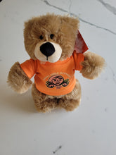 Load image into Gallery viewer, 10&quot; Teddy Bear stuffie with Every Child Matters Tshirt, a Native artist Bill Helin design
