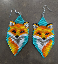 Load image into Gallery viewer, Beaded fox-shaped earrings on a gray surface
