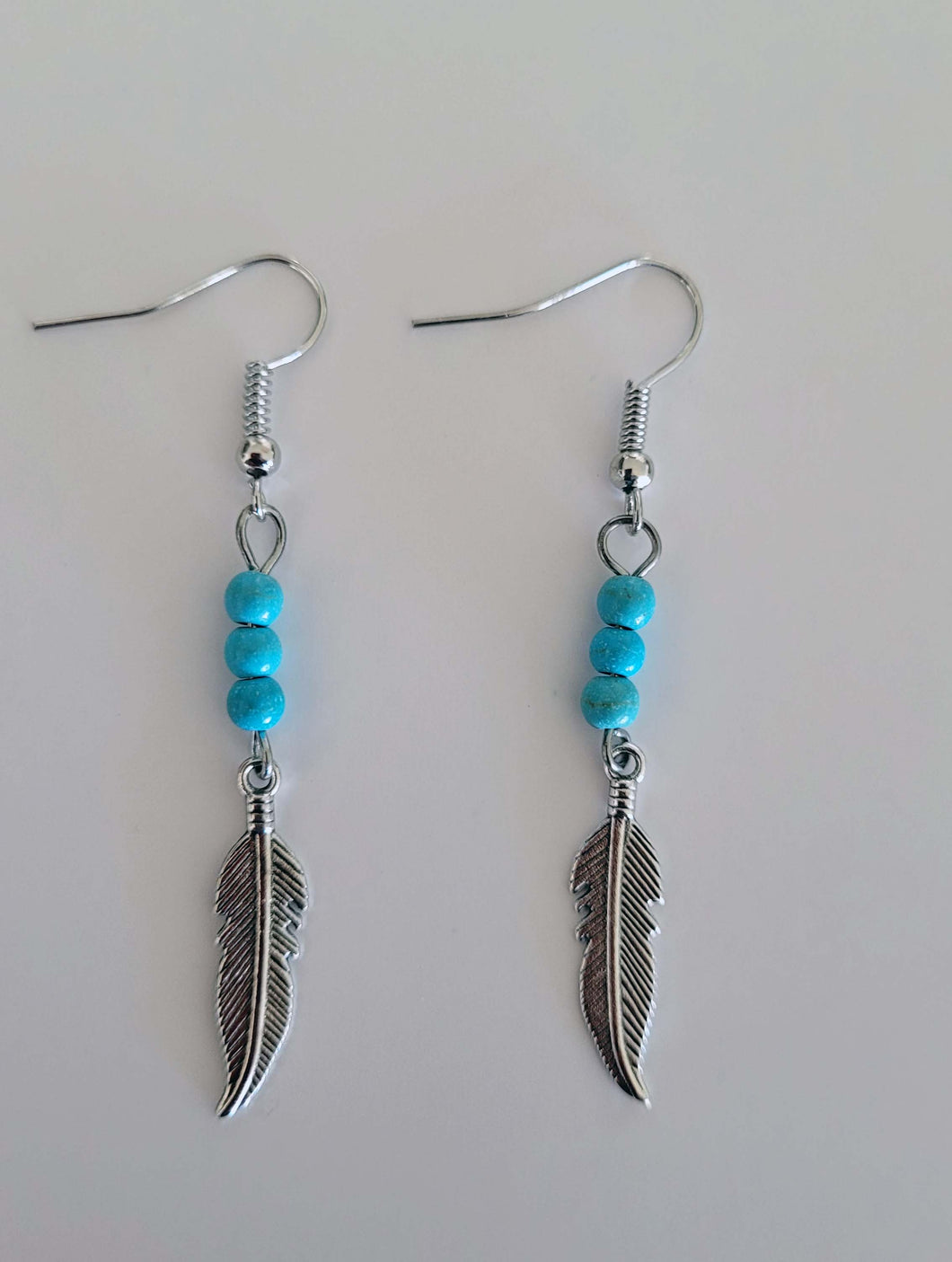 Faux turquoise feather earrings
